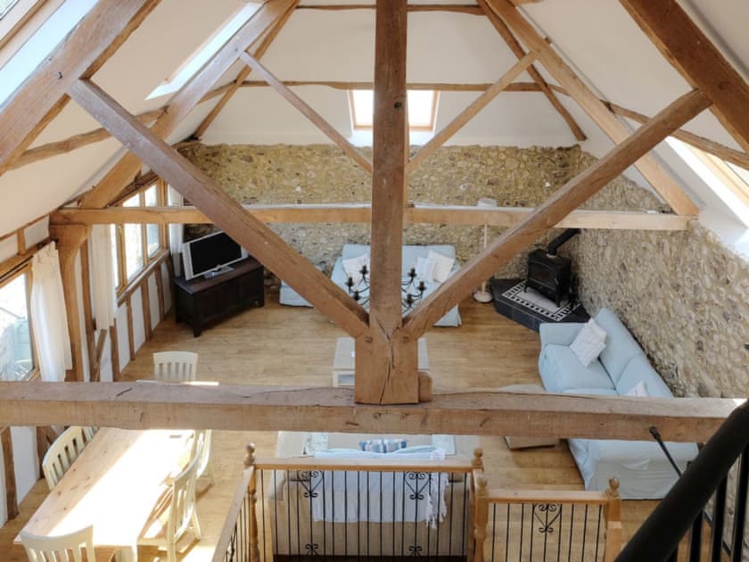 Exposed wooden trusses and beams throughout | The Old Barn - Rockenhayne Farmstead, Branscombe