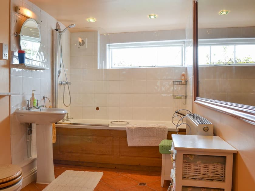 Bathroom with shower over the bath | Bugatti House, Bosbury, near Ledbury