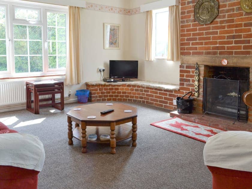 Welcoming living room | The Lodge - Scarning Dale Cottages, Scarning, near Dereham
