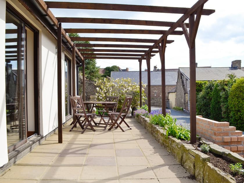 Paved terrace with outdoor furniture | Three Views Bungalow, Talgarth, near Hay-on-Wye