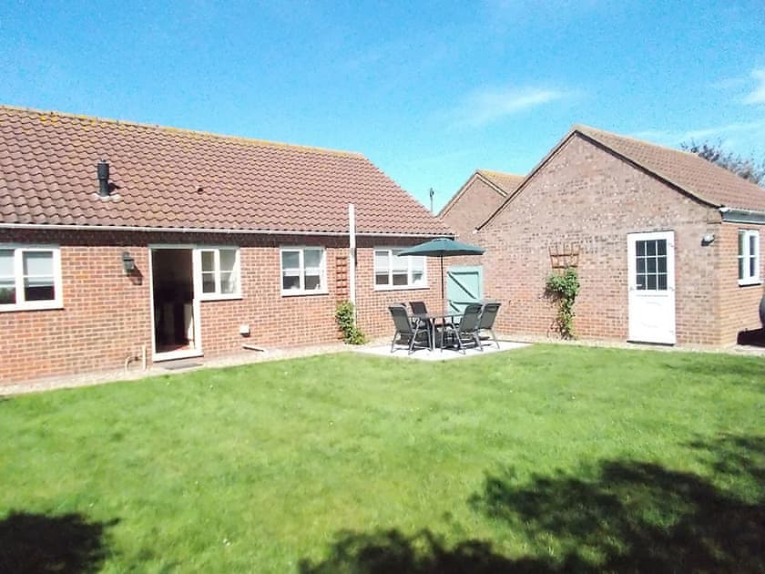 Enclosed lawned rear garden | The Chase, Walcott, near North Walsham