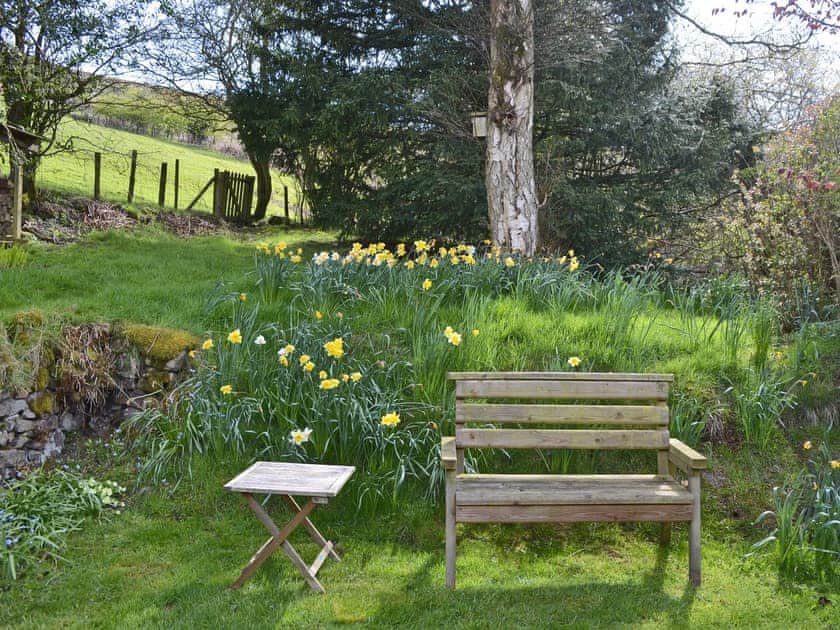 Peaceful sitting-out-area | Upper Stanbatch Cottage, Wentnor, near Bishops Castle