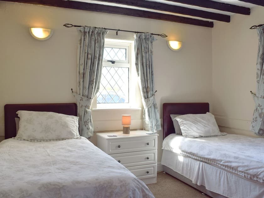 Twin bedroom with beamed ceiling | Green Acre Cottage, Kilgetty, Dyfed 