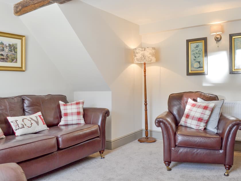 Comfy seating within living room | Blackcurrant Cottage at Stanton Ford Farm, Baslow, near Bakewell