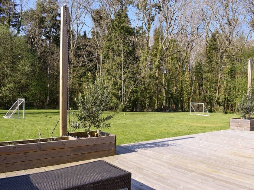 Decked area at rear of property | Pigeon Coo Farmhouse, Hamstead, near Yarmouth