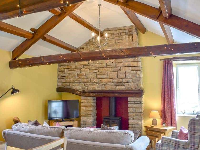 Characterful living room with beamed ceiling | Timbessie Barn, Carperby, near Leyburn