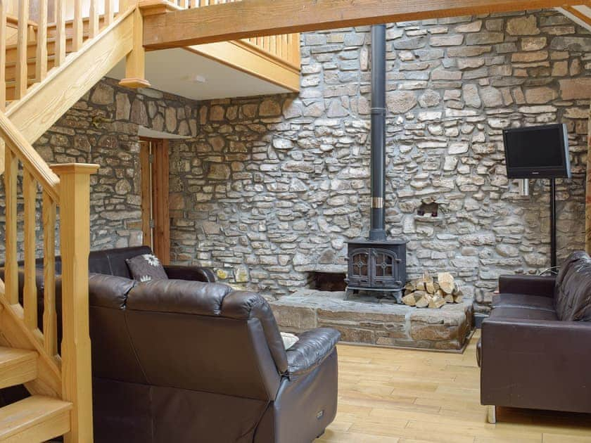 Comfortable living room with wood burner | Pentre Cottage - Three Rivers Farm Cottages, Ferryside