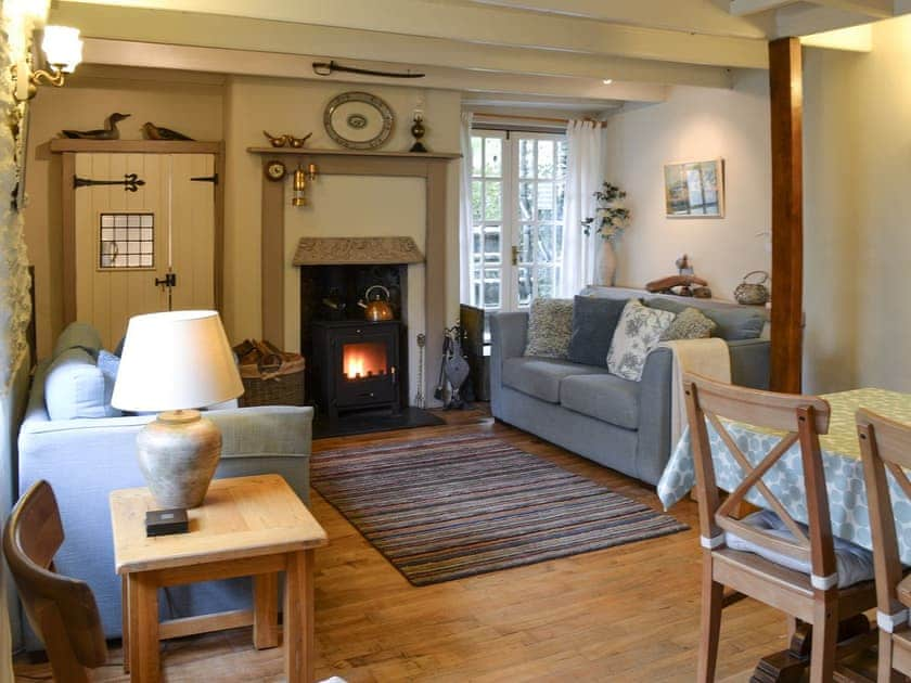 Living room with dining area & wood burner | Fairmaiden, Polruan-by-Fowey