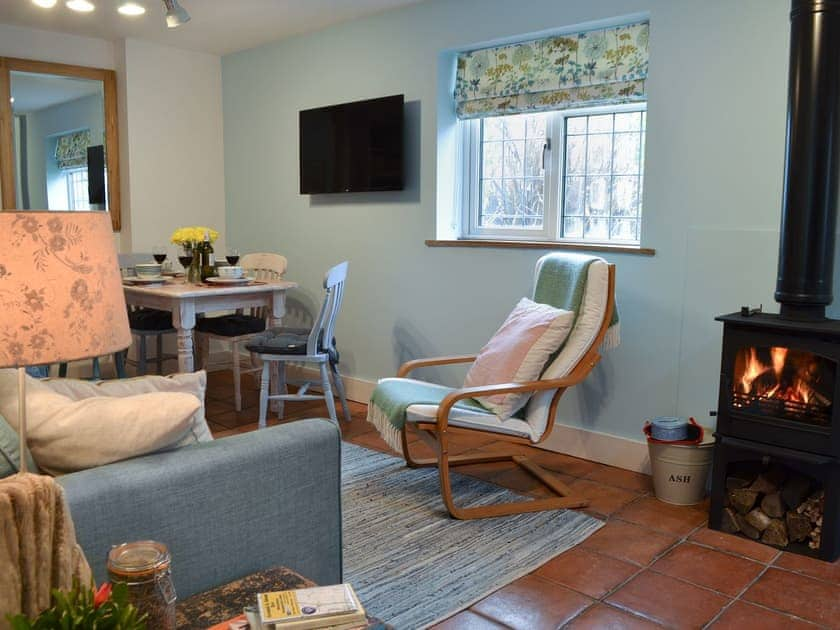 Cosy living/dining room with wood burner | The Blue Loft, Playden, near Rye