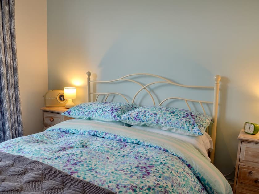 Bright and airy double bedroom with French doors leading to decked terrace | The Blue Loft, Playden, near Rye