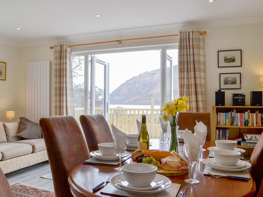 Delightful spacious living/dining area eith French doors to the decked area | Invernoe Cottage, Taynuilt, near Oban