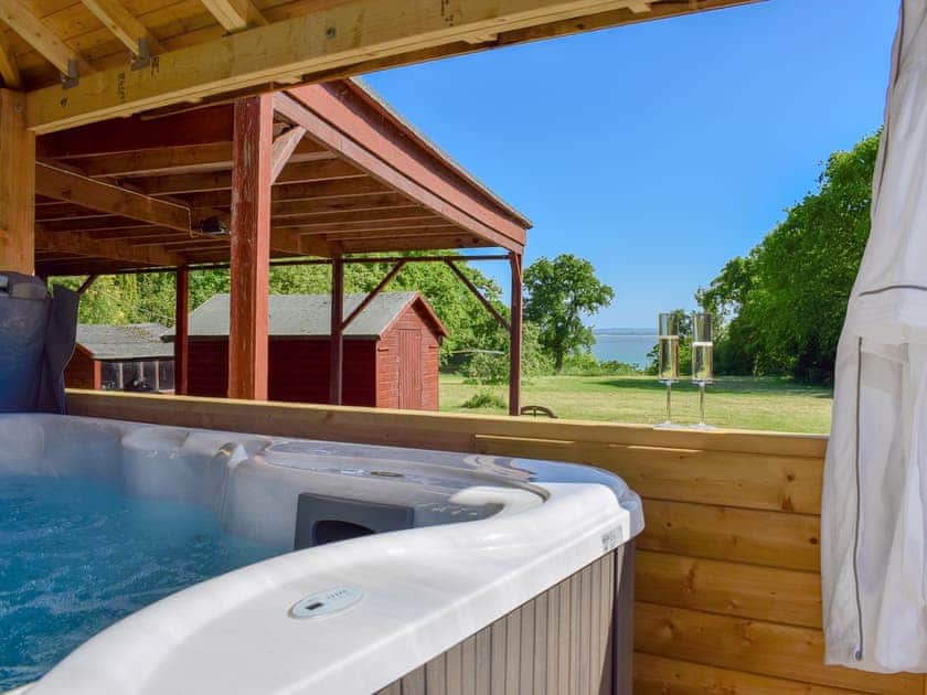 Amazing private Jacuzzi hot tub for 6, with a covered roof and sea views | The Coach House, Wootton, near Ryde