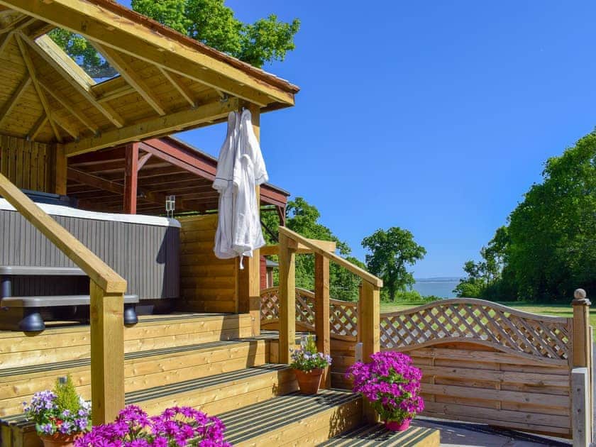 Amazing private Jacuzzi hot tub for 6, with a covered roof and sea views | The Coach House, Wootton, near Ryde