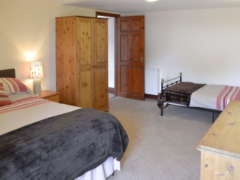 Bedroom with double bed and an additional single bed | Trescowthick Barn, St Newlyn, near Newquay
