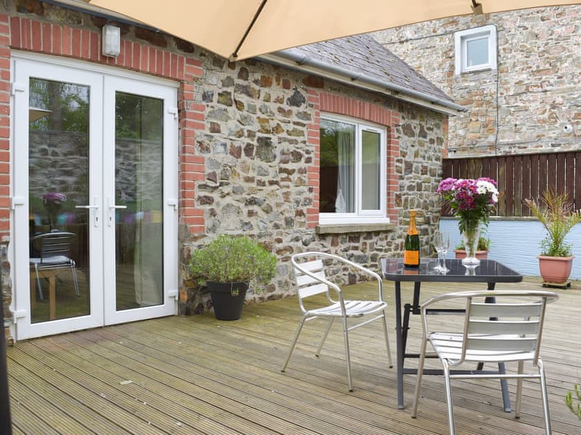 French door access to the decked patio area | Llwynbedw, St Dogmaels, near Cardigan