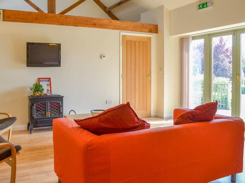 Beautifully light and airy living are with French doors to the garden | Stables Cottage - Mackinder Farms, Brayton, Selby
