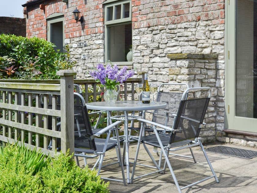 Paved patio area with furniture | Stables Cottage - Mackinder Farms, Brayton, Selby
