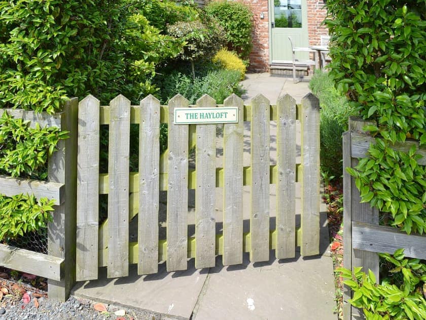 Charming gated garden entrance | The Hayloft - Mackinder Farms, Brayton, Selby