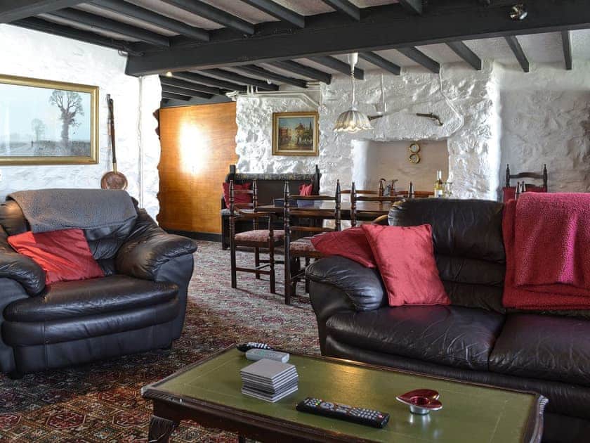 Living room with dining area | Porth Colmon Farmhouse, Porth Colmon, near Pwllheli