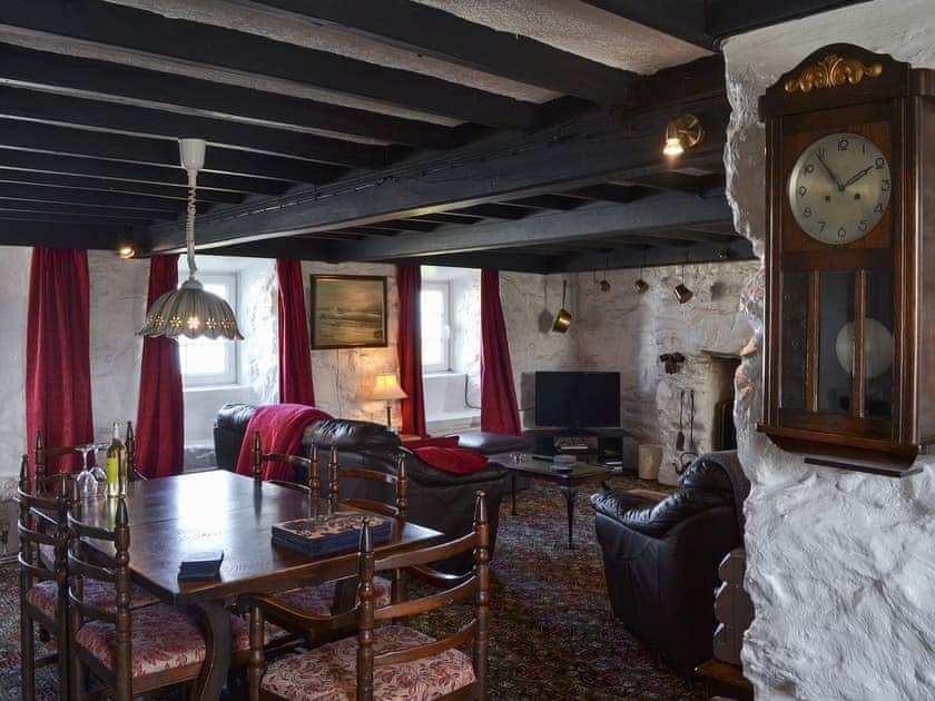 Living room with dining area | Porth Colmon Farmhouse, Porth Colmon, near Pwllheli