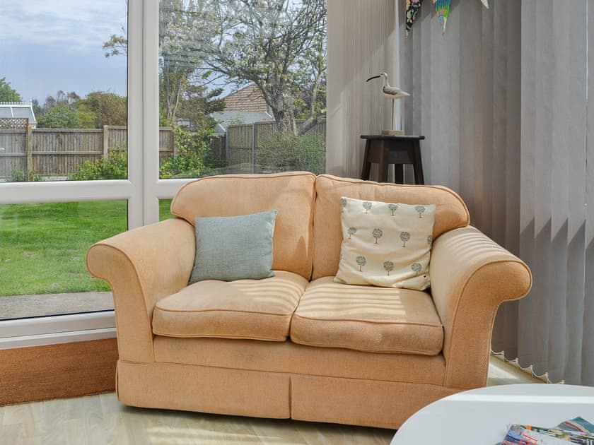 Delightful conservatory/sun room overlooking the garden | Sea La Vie, Mundesley, near North Walsham