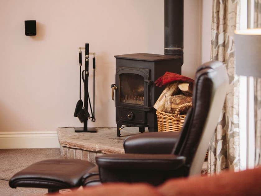 Welcoming wood burner in living area | Watson Cottage, Castle Carrock, near Brampton