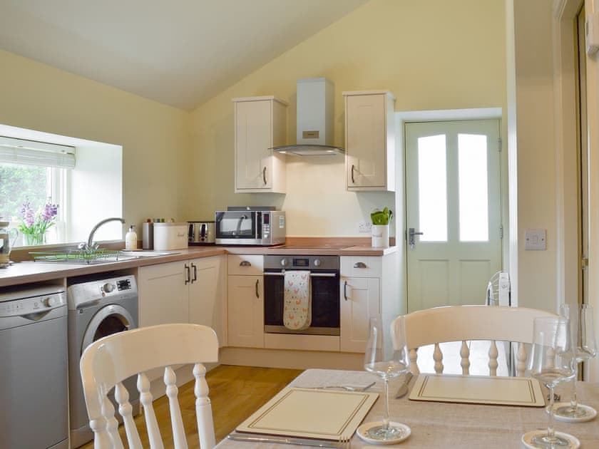Well equipped kitchen/ dining area | Alphin Apartment, Mossley