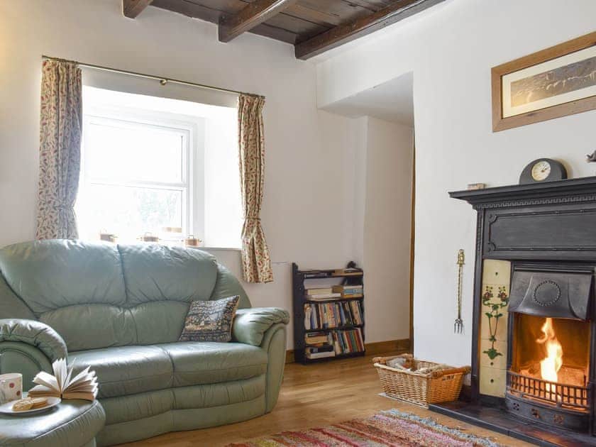 Inviting living room with open fire | Brookside, Langthwaite, near Reeth