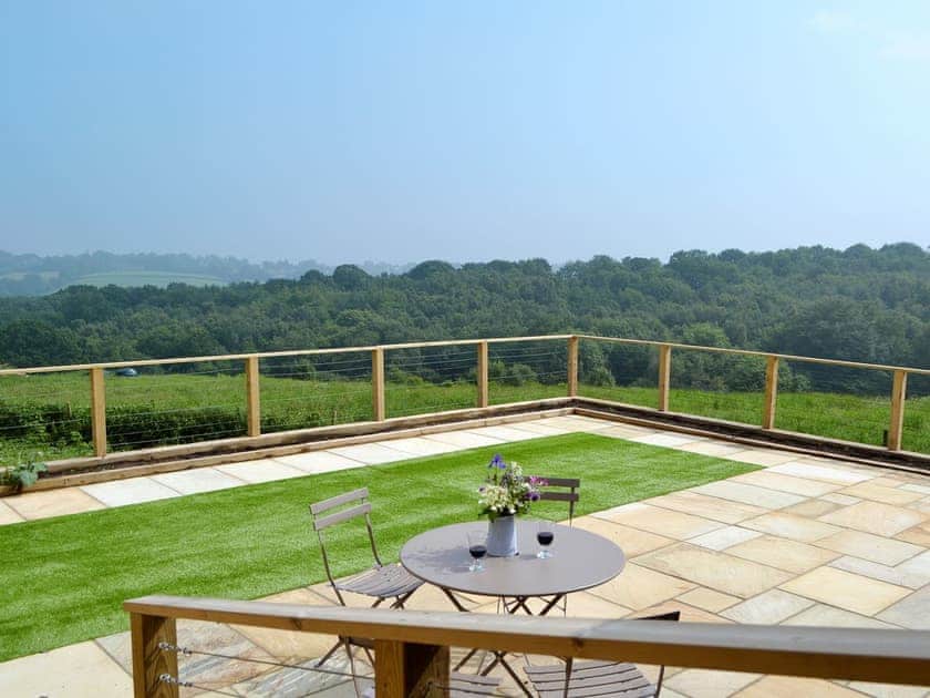 Impressive decked verandah with spectacular views | Poachers View - Netherfield Hill Farm, Netherfield, near Battle