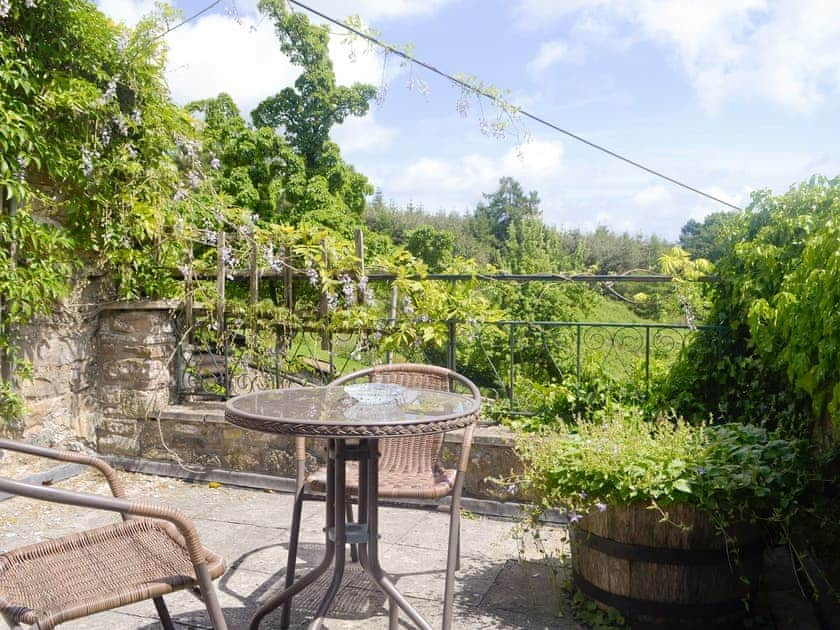 Enclosed patio area with outdoor furniture | The Hayloft, Edge Hills, near Littledean