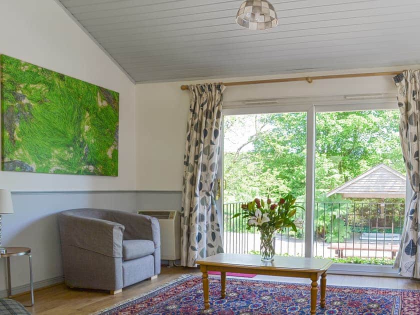 Spacious living area with sliding door to patio | Tigh A Vullin, Ardfern, near Lochgilphead