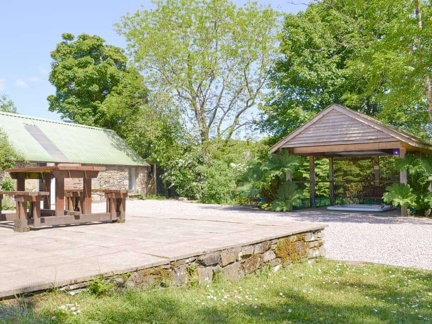 Raised patio area overlooking the hot tub | Tigh A Vullin, Ardfern, near Lochgilphead