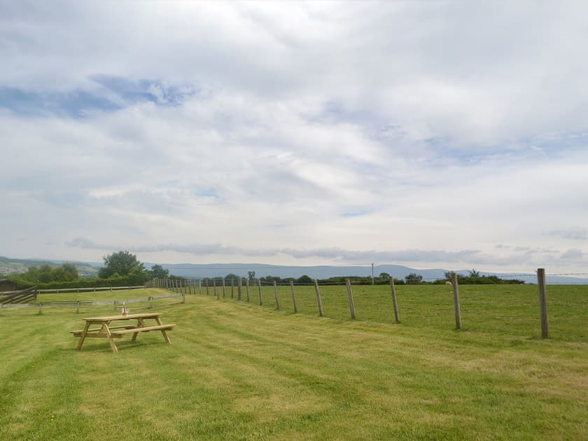 Private grassed area with picnic area | Kaptain’s Cabin, Yanwath, near Pooley Bridge