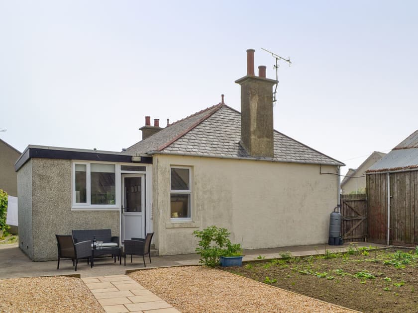 Rear of property with garden and patio area | Westcliff, Whitehills, near Banff