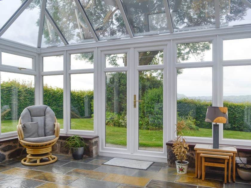 Spacious conservatory with access to garden | Green Lane Cottage, Aberhafesp, near Newtown