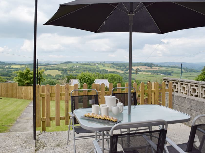 Patio area overlooking the rear garden | Awelfryn, Llandybie, near Llandeilo
