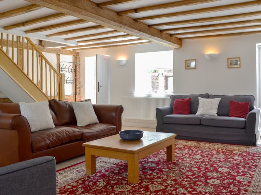 Spacious, beamed living room | The Hop Cottage - Castle Properties, Ashperton, near Ledbury