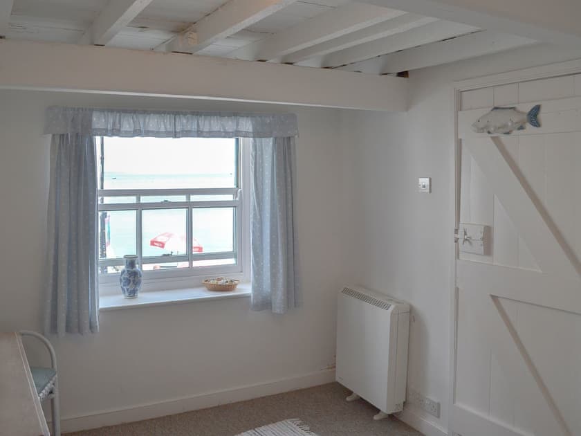 Beamed double bedroom with views out to sea | Beach Corner Cottage, Gorran Haven, near St Austell