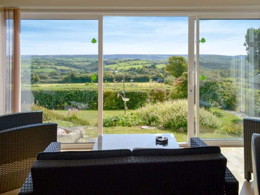 Living room with glorious panoramic countryside views | Beacon Cottage, Bittaford, near Ivybridge