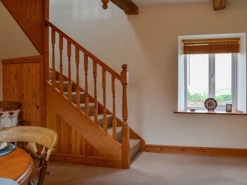 Dining table and staircase | Farm Cottage - Springfield Farm Cottages, Bigrigg, near Egremont
