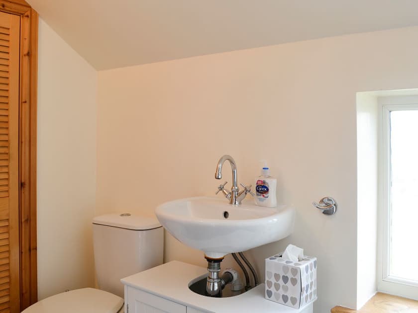 Utility room with adjacent cloakroom | Farm Cottage - Springfield Farm Cottages, Bigrigg, near Egremont