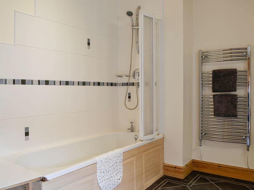 Tiled bathroom with shower over the bath | Farm Cottage - Springfield Farm Cottages, Bigrigg, near Egremont