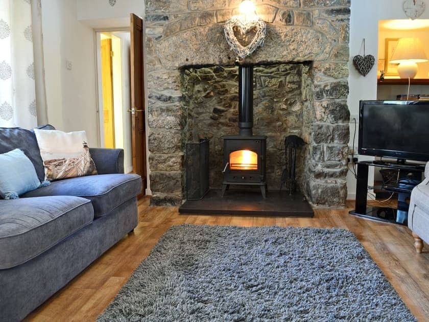 Beautifully presented living room with wood burner | Didfa, Llangoed, near Beaumaris