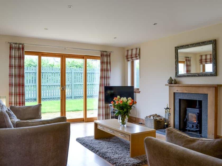 Living room with wood burning stove | Allt Mor, Aviemore