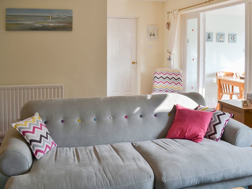 Comfortable sofas in the living room | Longstone Bungalow, Beadnell