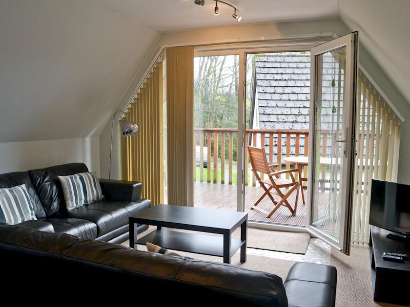 Lounge area with patio doors leading onto balcony | Valley Lodge, St. Anns Chapel, near Callington
