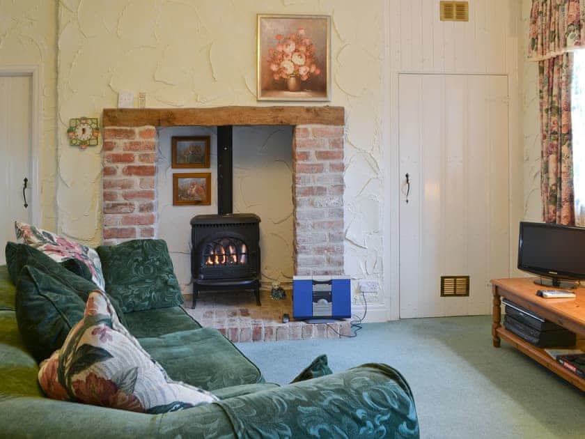 Cosy lounge area with heritage fireplace | Skiddaw Apartment - Whitecraggs, Ambleside