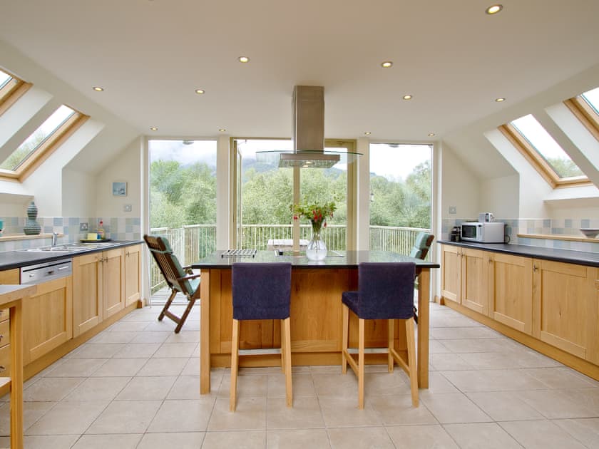 Spacious and well-equipped kitchen area with French doors onto the balcony | Carness West, North Ballachulish, Glencoe