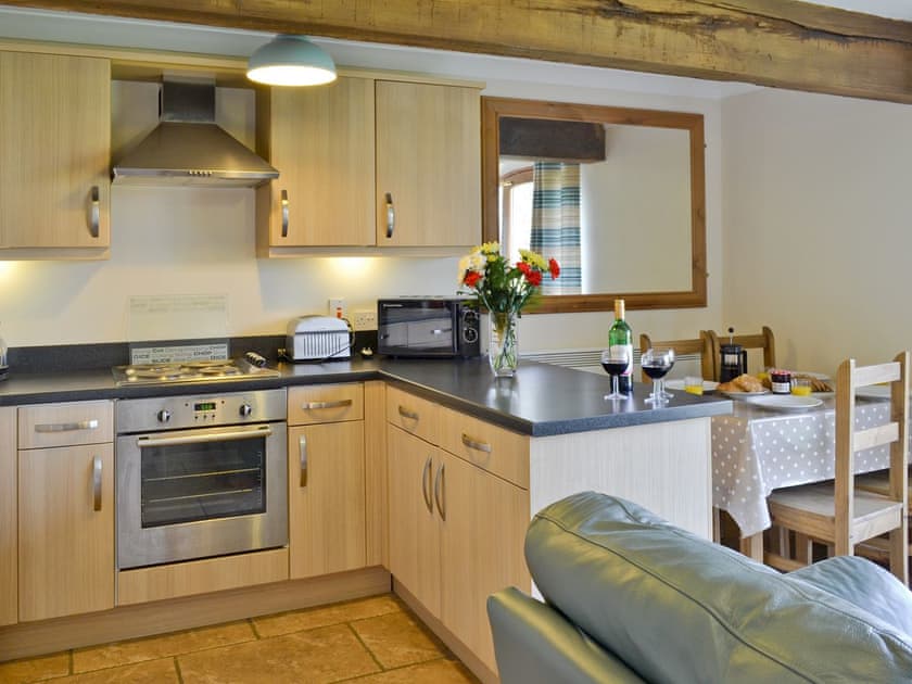 Well-equipped kitchen and dining area | Vaughan Cottage - Filey Holiday Cottages, Filey