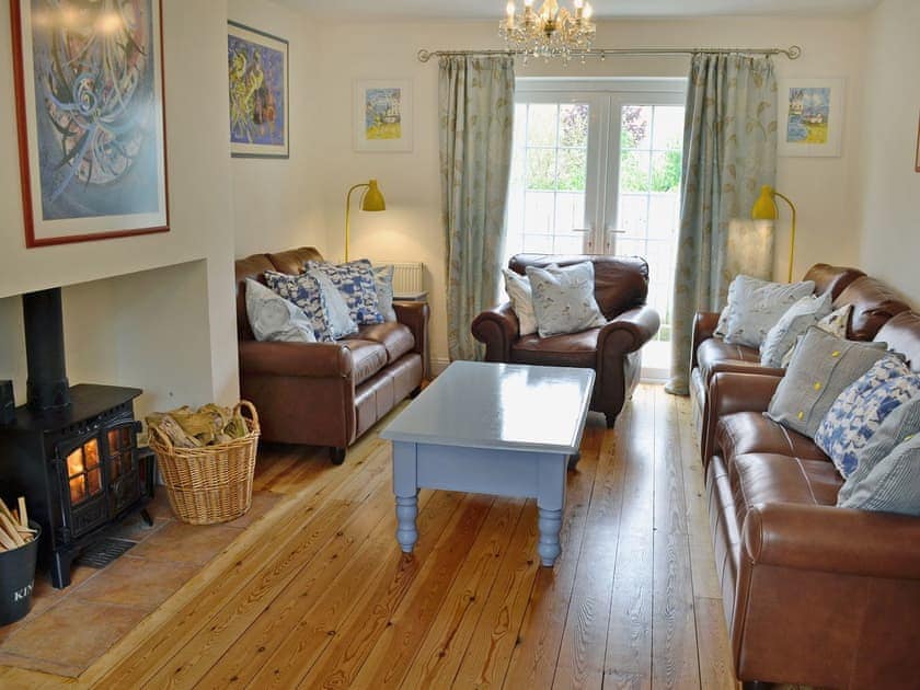 Beautifully decorated living room cosy woodburner | Woodbrook Cottage, Bothenhampton, near Bridport